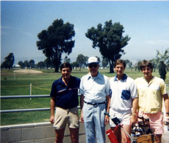 Dad at the golf course with sons